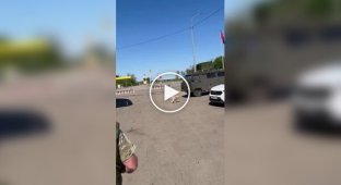 Russians in the Belgorod region watch a UAV attack and their burning armored vehicle