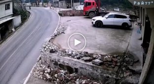 An out-of-control truck miraculously avoided crushing a motorcyclist and was caught on video in China (lower sound)