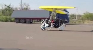 In Kazakhstan, a man on a hang glider landed at a gas station, filled up, and flew away again