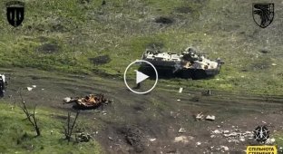 A foreign mercenary of the Russian Army futilely fights off a kamikaze drone of soldiers of the 93rd Mechanized Infantry Brigade with a stick.