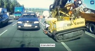 In Russia, a truck crane collapsed onto a passenger car with a woman inside