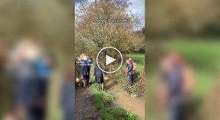 Unsuccessful attempt of women to cross a stream