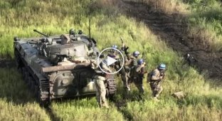 Ukrainian T-80BV tank supports the advance of BMP-2 infantry