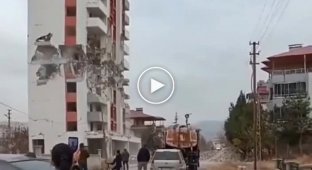 Explosive experts in Turkey dropped a 12-story building onto neighboring houses