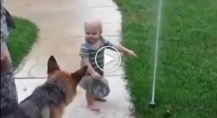 Kid shows his friend that there is no need to be afraid of the sprinkler