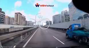 A bus blocks several lanes to make a U-turn