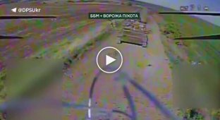 A kamikaze drone attacks an enemy armored vehicle with Russian infantrymen on armor in the Kupyansk direction
