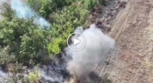 Pieces of the body of a Russian invader fly high into the air after a grenade is dropped