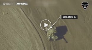 An enemy 2S19 Msta-S self-propelled gun disappears in flames after an attack by Ukrainian drones
