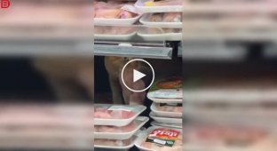 A ginger cat made himself lunch right in the supermarket display case