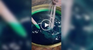 Sand harmony: the process of creating a mandala from colored sand.