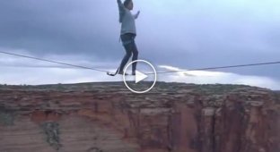 The girl decided to walk the tightrope between the rocks