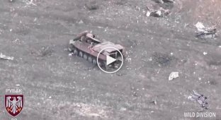 A kamikaze drone detects and eliminates three invaders hiding in destroyed armored vehicles