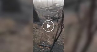 An occupier films his destroyed self-propelled gun