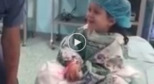 Kind anesthesiologist calms a girl before surgery