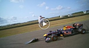 BMX bike jump over Formula 1 car