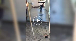 A woman walked on freshly poured concrete