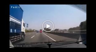 Truck with broken wheels overturned and blocked traffic on the highway