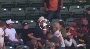 A guy caught a ball and gave a girl an unforgettable gift