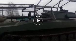 Ukrainian 122-mm self-propelled howitzer 2S1 "Gvozdika" with a UAV network to combat kamikaze on the turret and hull