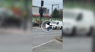 In London, a passerby helped direct traffic after a traffic light failed