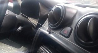 Riddle: what is the fishing line for inside the car? (3 photos)