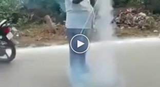 Hindu man lights fireworks for two