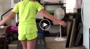 Redhead shows a trick on a treadmill