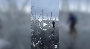 Girl skates on frozen swamp