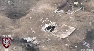 A Ukrainian kamikaze drone flies into a trench near the Russian military in the Zaporozhye region