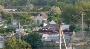 The collapse of a residential building in the flood zone in the Kherson region