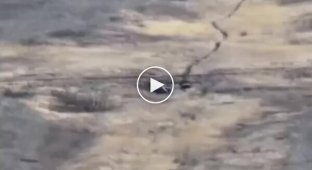 Pieces of an enemy BMP-2 fly high in the air after an attack by a Ukrainian drone
