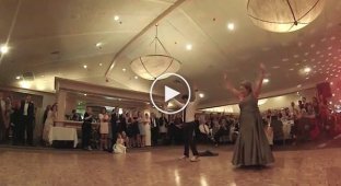 Groovy dance of mother and son at a wedding
