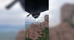 Flying through a small triangular hole in the famous Montserrat mountain in Catalonia