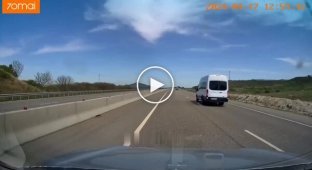 Racer in an orange Porsche and on the side of the road