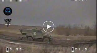 A drone attacks an enemy armored vehicle stuck in the ground