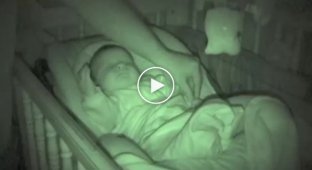 Sleeping baby and playful hands