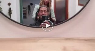 Woman's reaction to her husband's new hairstyle