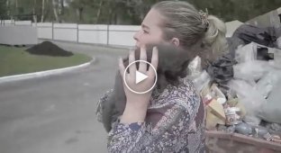 She found this baby in a trash heap. Look who this unknown animal is