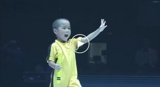 Mastery is not measured by age. Five-year-old boy demonstrates Bruce Lee's famous style