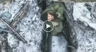 Donetsk region, a Ukrainian drone drops a grenade into a Russian military trench
