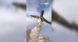 Be-200 flies right over people while dropping water on a fire in Algeria