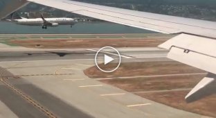 Two passenger planes landing at the same time