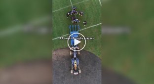 Formula 1 car vs. rugby players