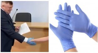 Мэр города Ишима в России вручил сертификаты молодым семьям, надев на руку медицинскую перчатку (2 фото + 1 видео)