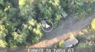 Ukrainian drones monitor three trucks parked among trees in the Lugansk region during the day
