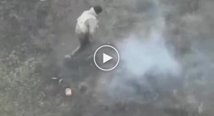 An occupier steps on an anti-personnel mine on the battlefield