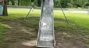 Child, slide and puddle, what could go wrong