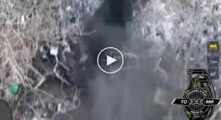 Donetsk region, a Ukrainian drone drops grenades into a Russian military trench
