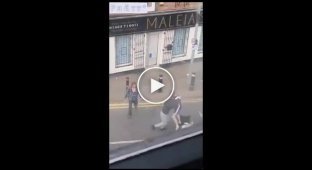 A woman intervened in a fight between guys near a pub